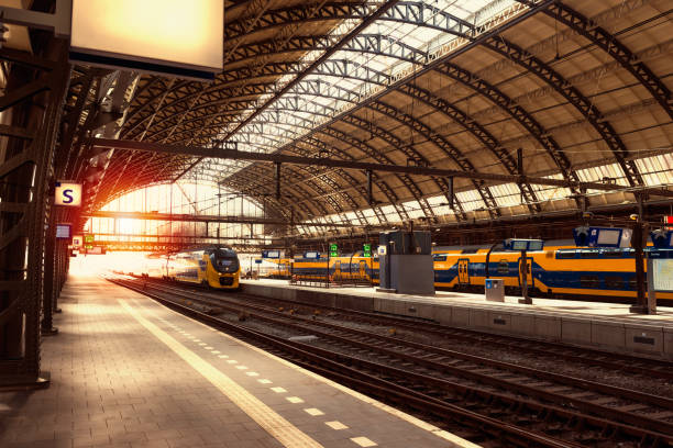 istock Railway station at rays of sunset 825704882