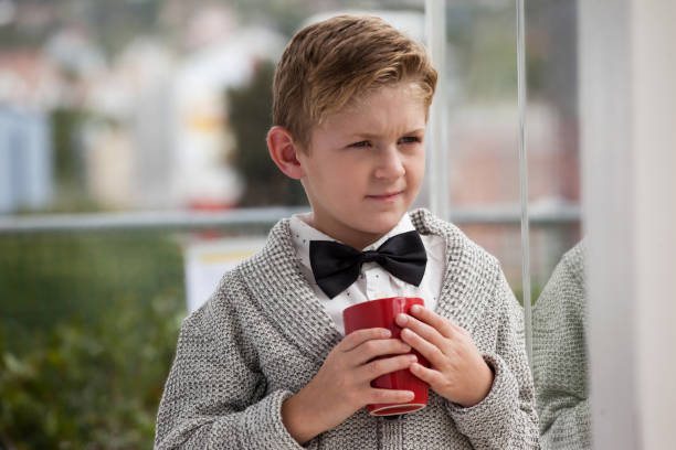 istock Thoughtful businessman looking away while holding coffee cup 825710410