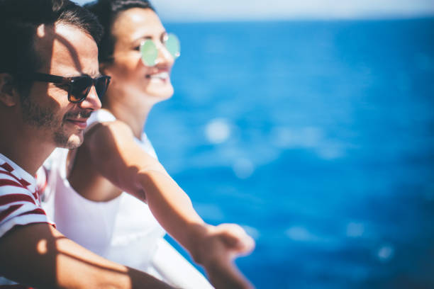 Couple on cruise ship on windy day