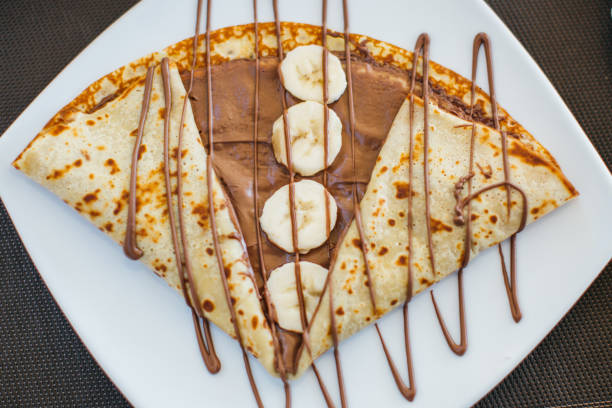 istock Crepes filled with Banana and Chocolate Hazelnut Spread 825715050