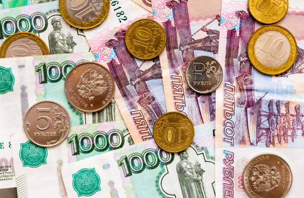 istock Russian money background. Rubles banknotes and coins 825718212