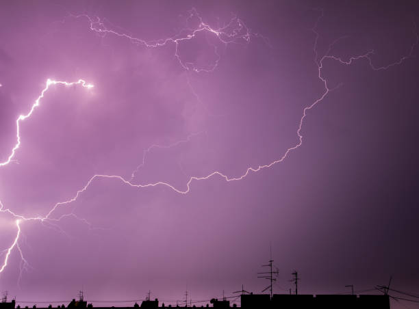 istock Lightning clouds thunderstorm over the city buildings 825718230