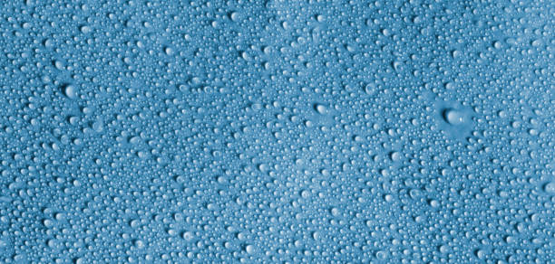 istock Deep blue round and small rain water drops and droplets 825718272
