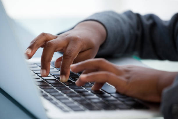 istock Cropped image of businesswoman using laptop 825718330