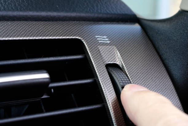 istock A woman's hand adjusts the vent on car dashboard 825718458
