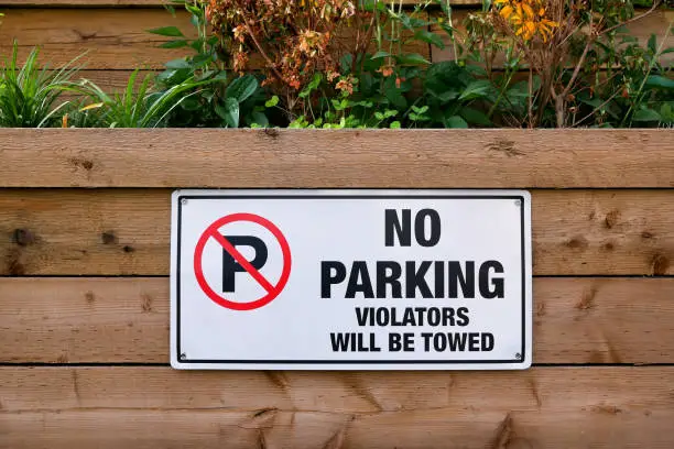No parking violators will be towed sign