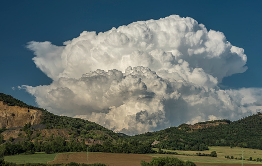 Big white cloud over valley of river Labe with blue sky