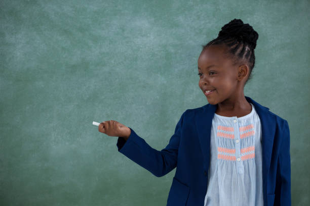 istock Businesswoman holding chalk and gesturing 825721458