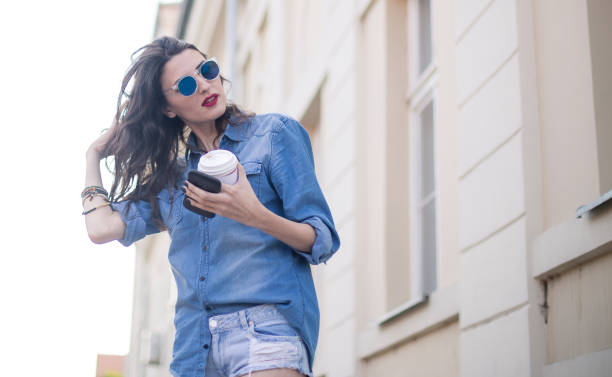 istock Woman with phone outdoors 825722234