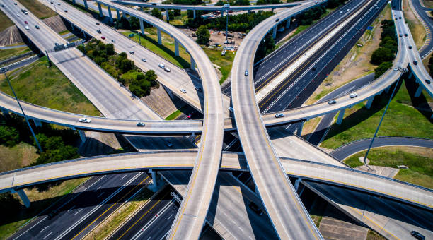 istock Curved highways and Interchanges and Overpasses aerial drone high above 825722478