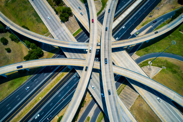straight down drone view high above abstract Curved highways and Interchanges and Overpasses aerial drone high above stock photo