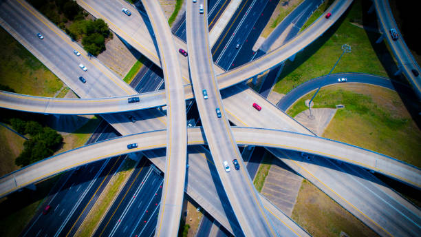istock Austin Texas USA Curved highways and Interchanges and Overpasses aerial drone high above 825722572