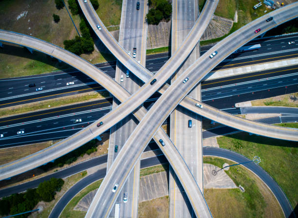 istock Crossing and Curved highways and Interchanges and Overpasses aerial drone high above 825722652