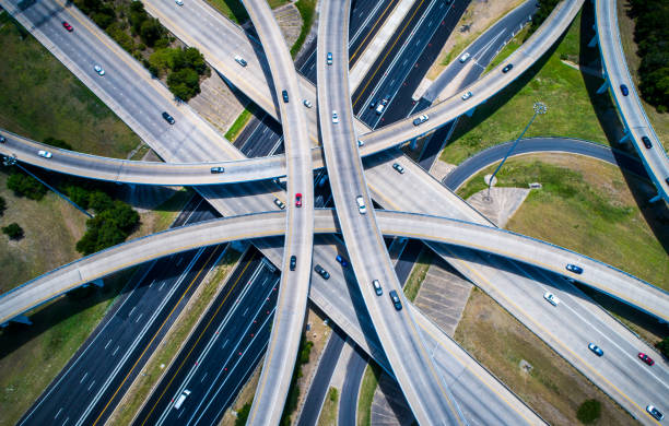 istock Abstract Aerial Straight down view Curved highways and Interchanges and Overpasses aerial drone high above 825722654