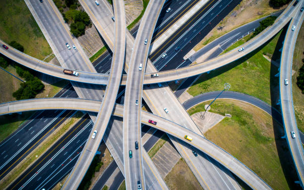 istock So many over passes Curved highways and Interchanges and Overpasses aerial drone high above 825722698