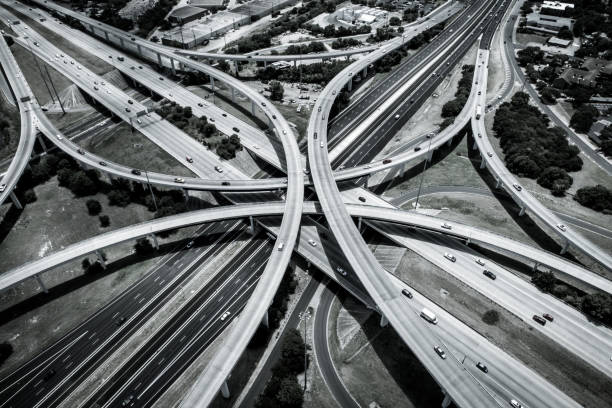 istock Abstract black and white Aerial view above Highways and Interchange Urban Sprawl infrastructure 825722702