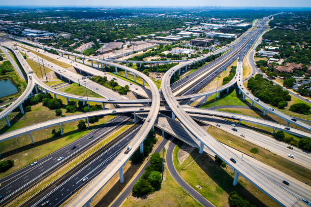istock Curved highways and Interchanges and Overpasses aerial drone high above 825722722