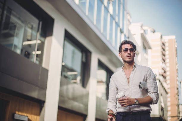 istock Attractive man with cup of coffee 825725244