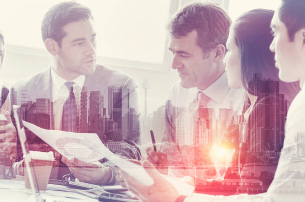 istock Five businesspeople working at the boardroom table. 825725740