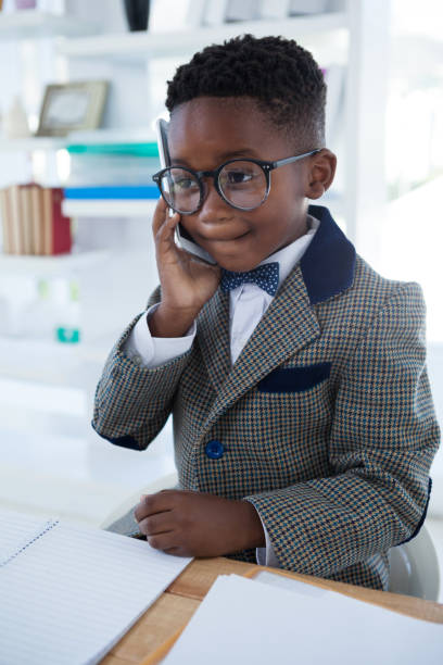 istock Serious businessman using mobile phone at desk 825726606