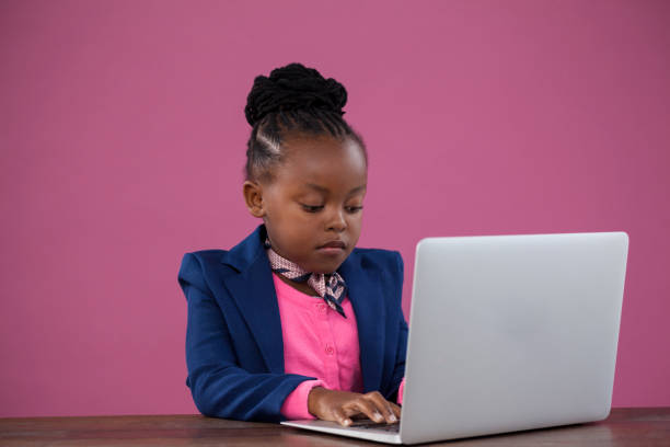 istock Serious businesswoman using laptop at desk 825726986