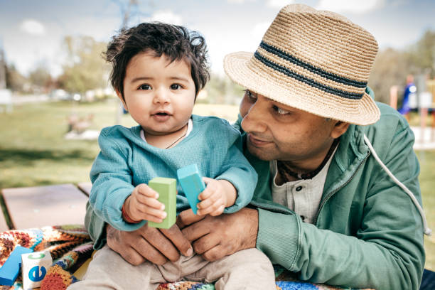 istock Father and baby in the park 825736912