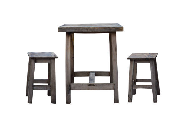 istock Old wooden table and old wooden chairs on white background. 825737252