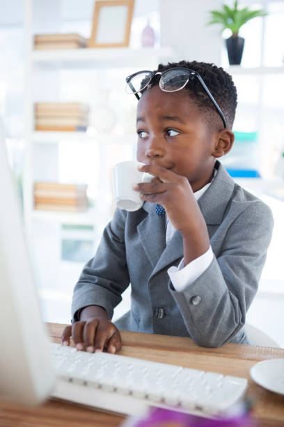 istock Thoughtful businessman drinking coffee at desk 825738014