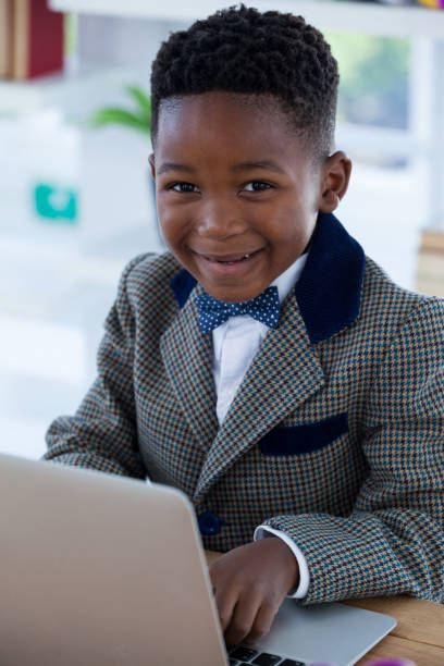 istock Portrait of smiling businessman using laptop 825738248
