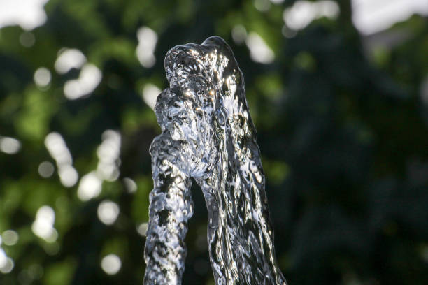 istock fresh water flows from hose against blurr background 825741490