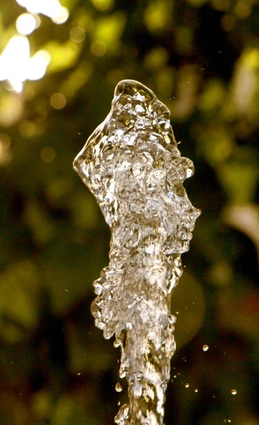 istock fresh water flows from hose against blurr background 825741518