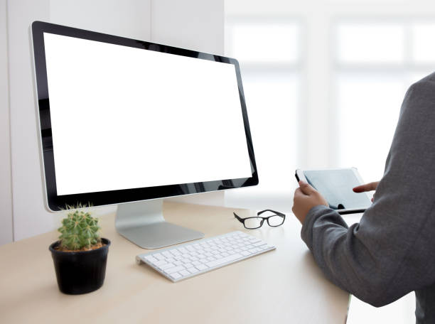 istock young man working Businessman using a desktop computer of the blank screen 825742378