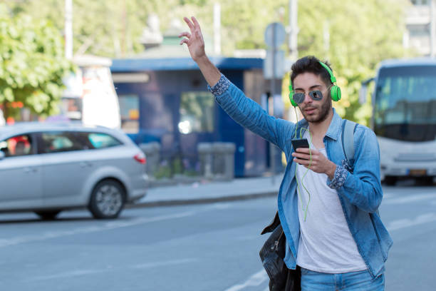 istock Young Man Hailing a Taxi . 825743014