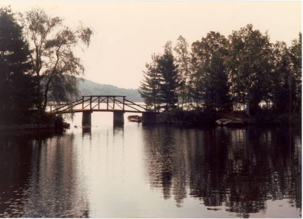 istock Small bridge across a narrows on a lake 825755522