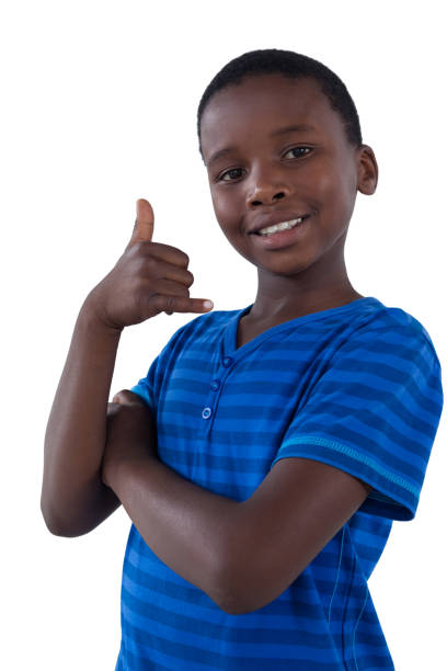istock Cute boy pretending to talk on a cell phone 825757716