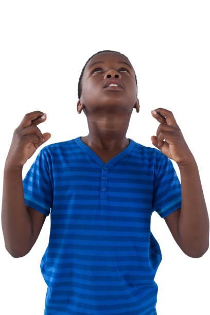 istock Cute boy holding his fingers crossed 825757994