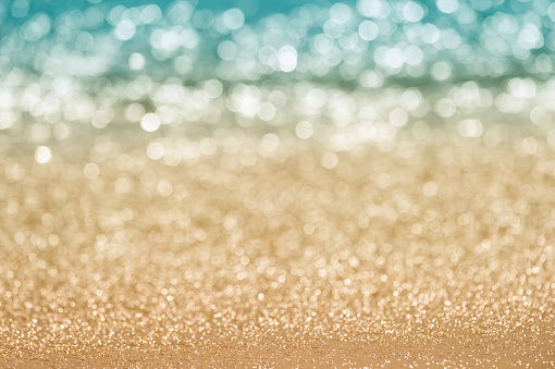Abstract blur seascape bokeh. Defocused sand beach and sea water in nature, evening summer time