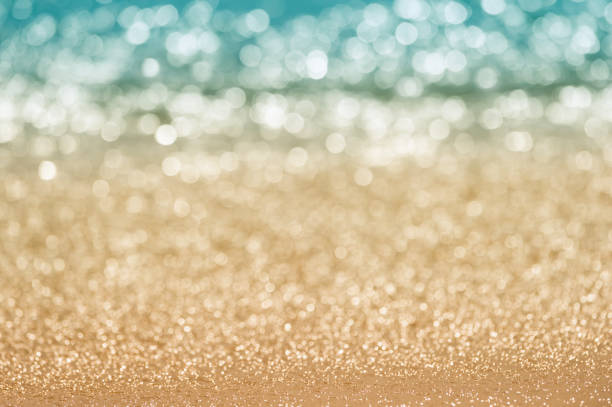 Abstract seascape bokeh. Abstract blur seascape bokeh. Defocused sand beach and sea water in nature, evening summer time glittering sea stock pictures, royalty-free photos & images