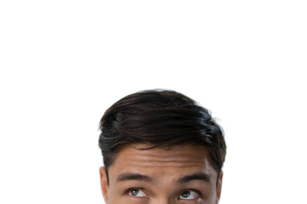 Spanish white male man with shaved face, blue eyes and dark short hair looking to the camera with a face of strangeness , disgusting news or surprise. Expression on a European man´s face concept.