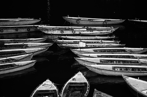 Zakynthos, Greece - August 17, 2016: Pleasure and fishing motor boats are moored in marina of Agios Sostis, black and white photo