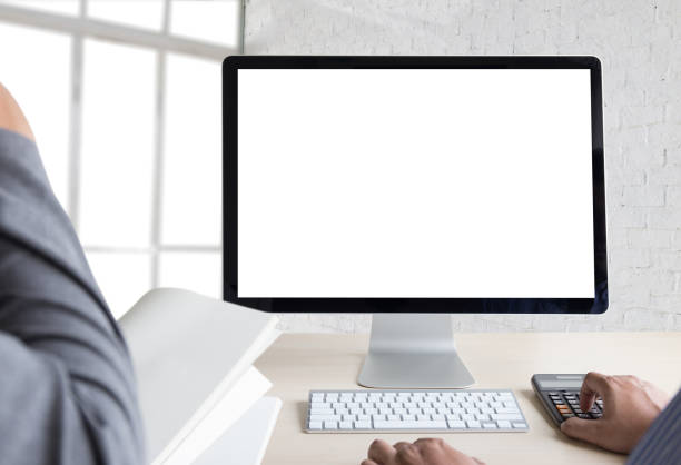istock young man working Businessman using a desktop computer of the blank screen 825781222