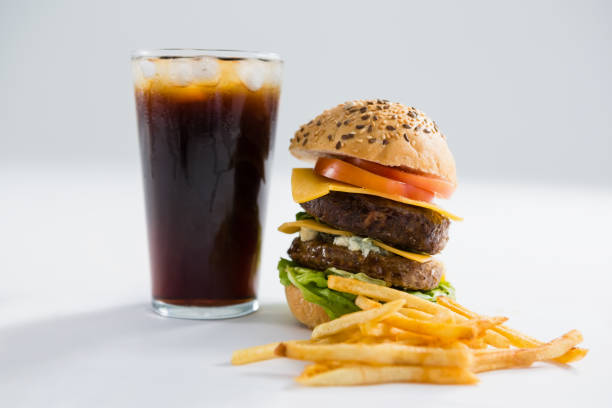 istock Burger and drink with French fries 825785258