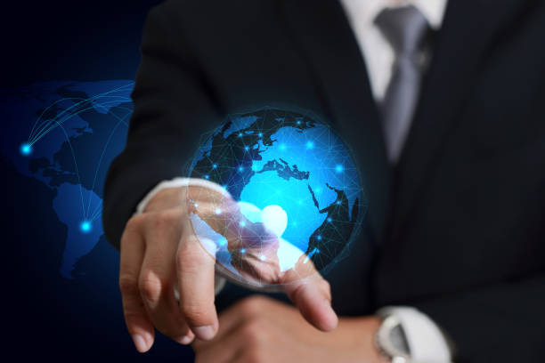 istock businessman touching, pointing  light blue circular world map line networking 825785280