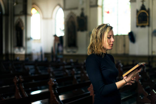 istock Woman Standing Church Religion Concept 825785518