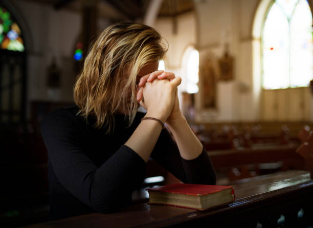istock Woman Sitting Church Religion Concept 825785652