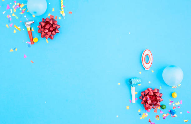 istock Number zero with various party confetti and balloons on a blue background 825785880