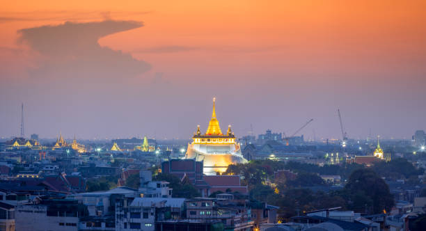 istock Golden mountain or Wat sraket with sunset background. 825788714