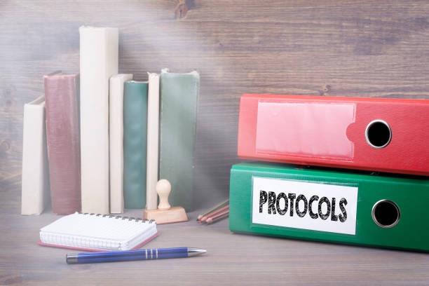 istock Protocols. Binder on desk in the office. Business background 825796842