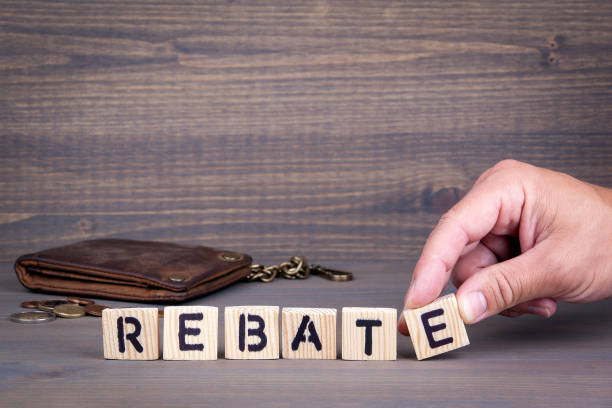 istock Rebate. Wooden letters on dark background 825796976