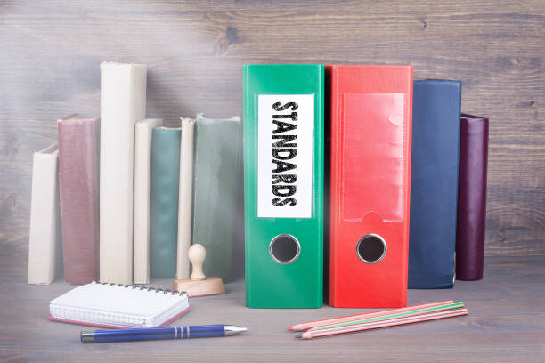 istock Standards. Binder on desk in the office. Business background 825799072